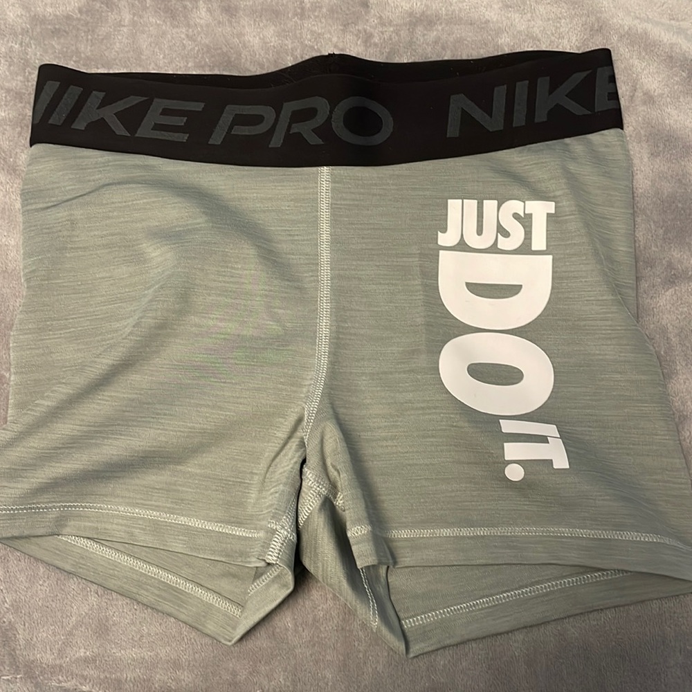 Light grey “just do it” nike pros, size medium